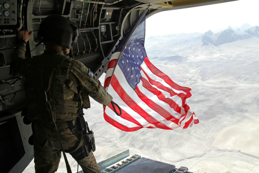 US soldier holding american flag | Join our team image